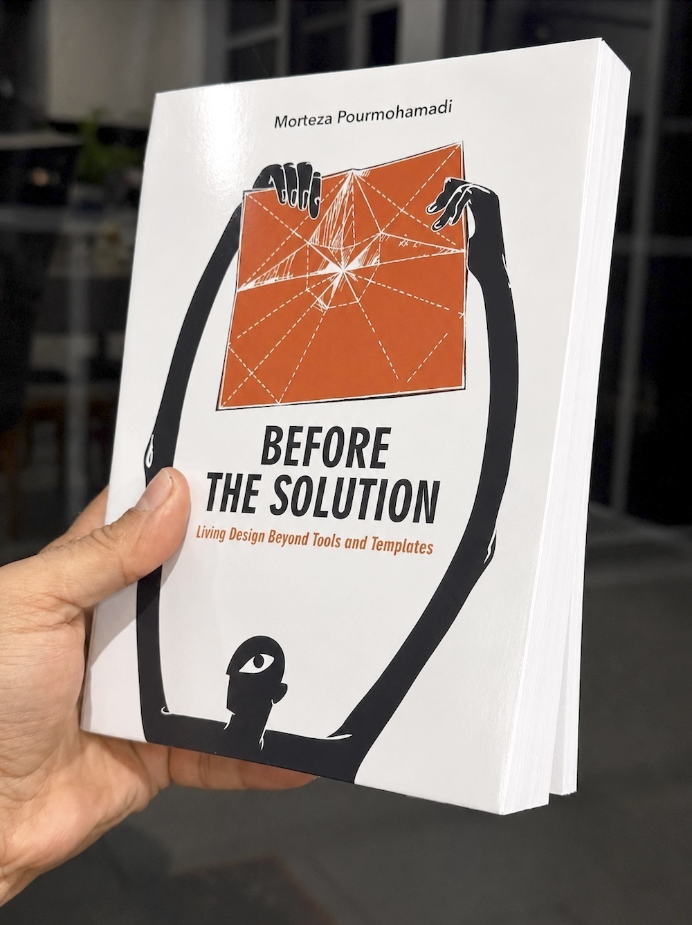 Before the Solution — paperback held in hand